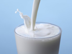 Milk pouring into glass